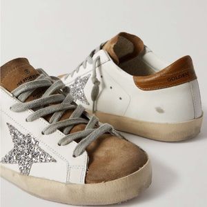 Golden Goose
Superstar glittered distressed leather and suede sneakers.